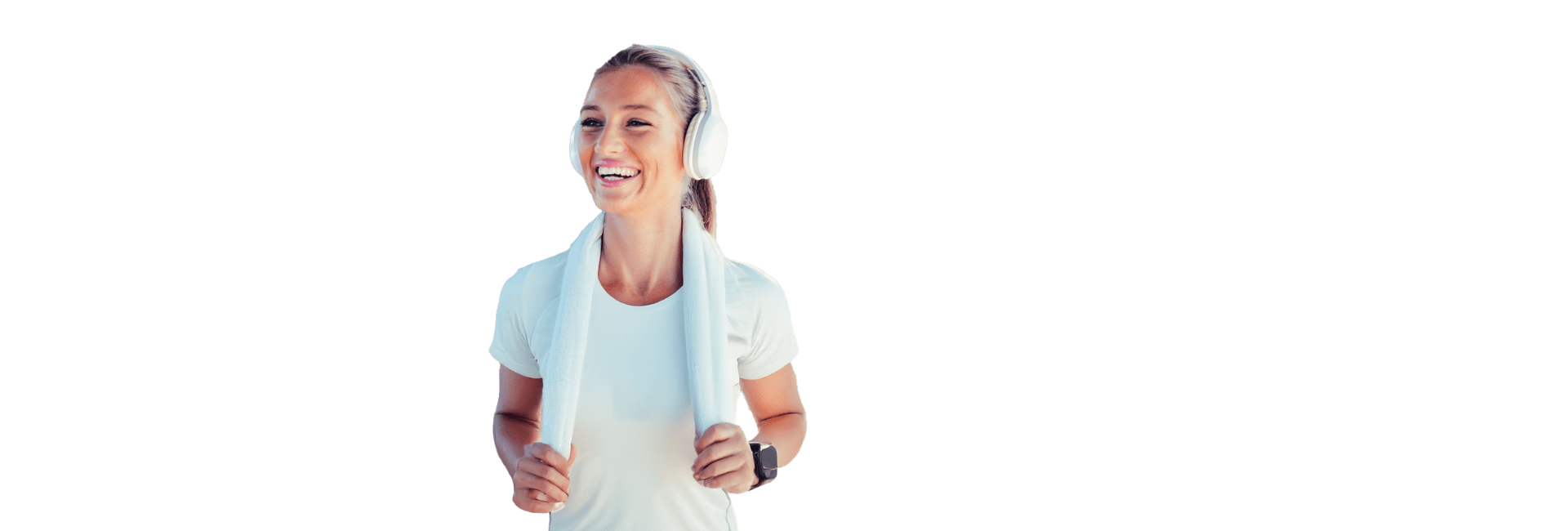 Smiling woman with headphones and towel representing cardio fitness at Everyone Fitness gym